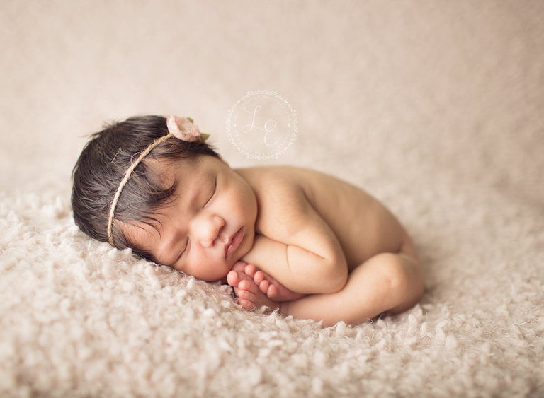 cuddly baby girl in taco pose