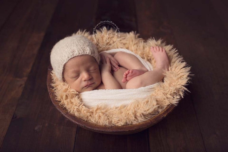 baby boy in a bowl with a cute hat
