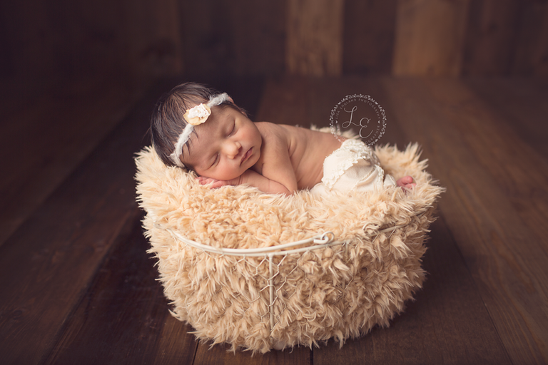 infant girl in a basket