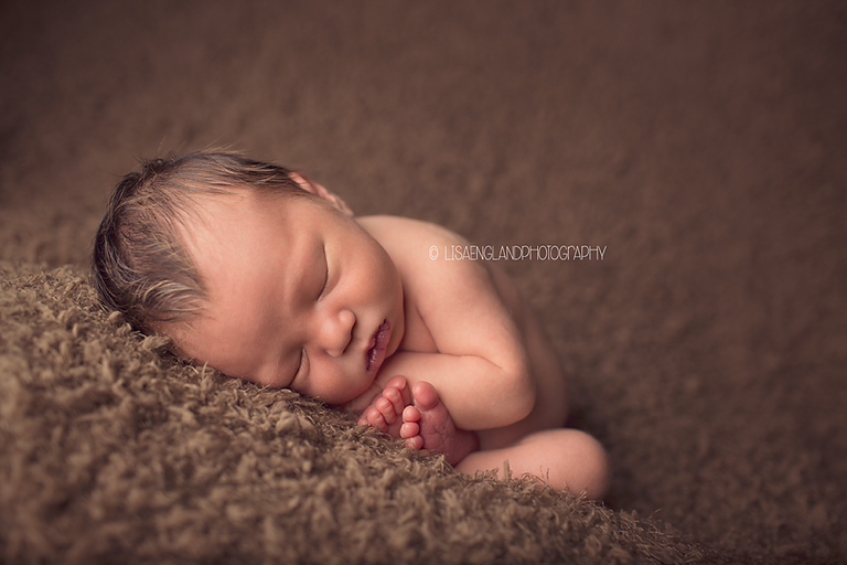 baby boy in the womb pose