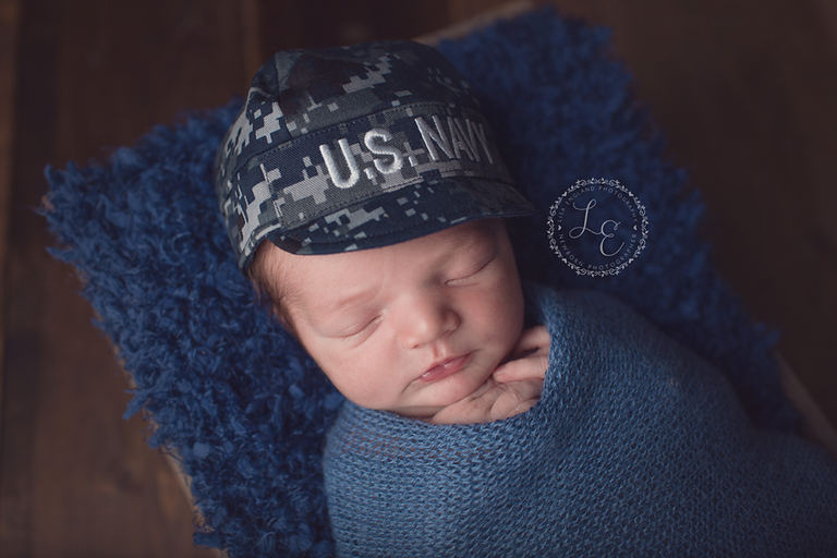 baby boy with navy hat on