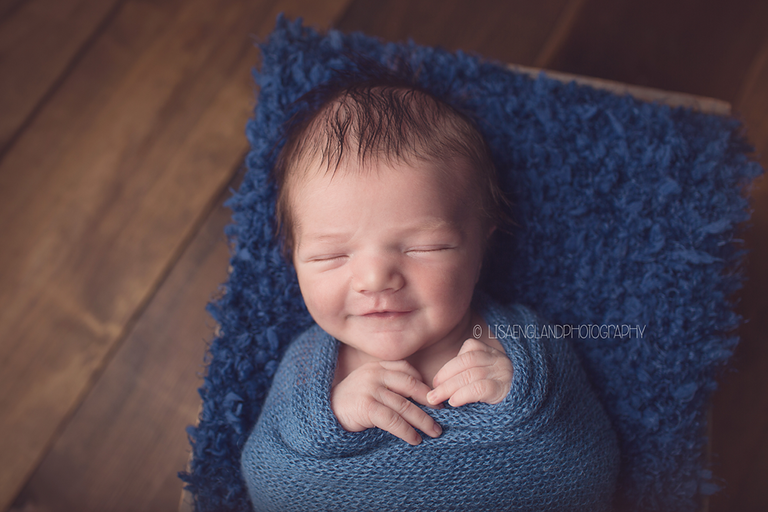 smiley baby boy in blue