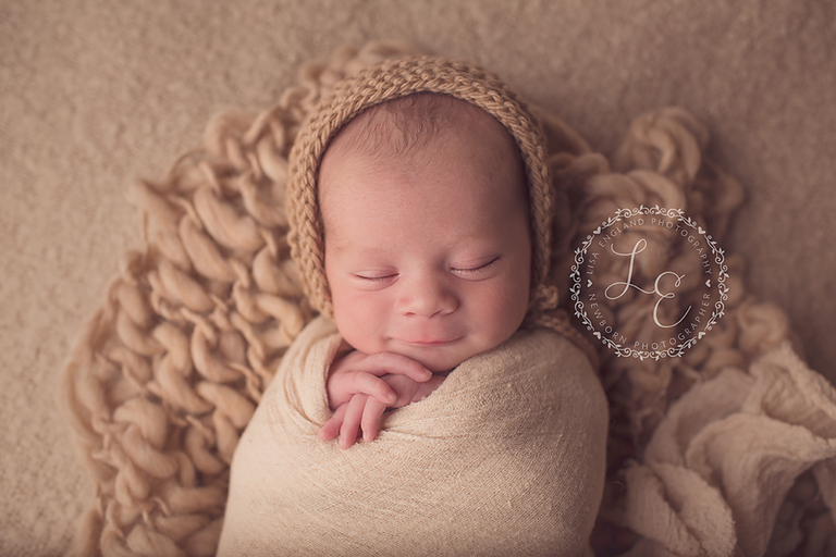 handsome baby boy in tan hat