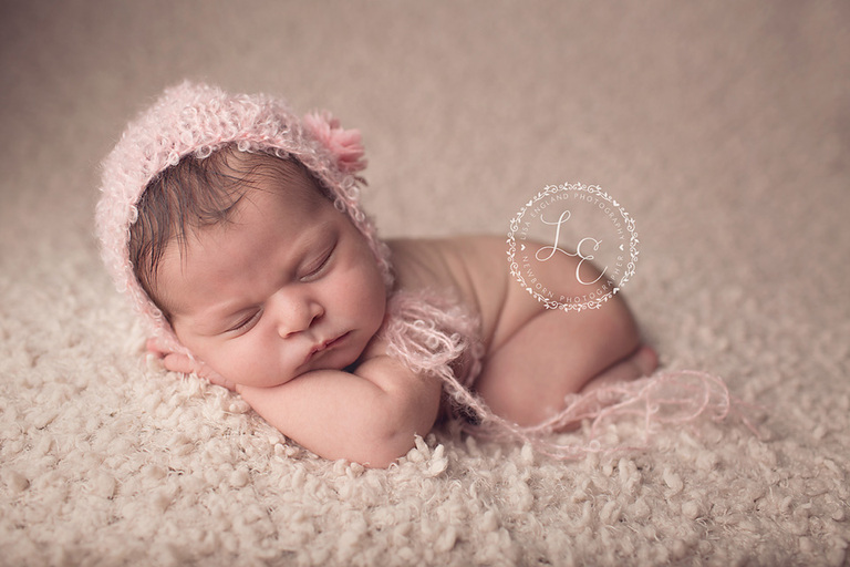 baby girl on cream with cute pink hat -San Diego, CA newborn photographer and baby photographer- Lisa England Photography