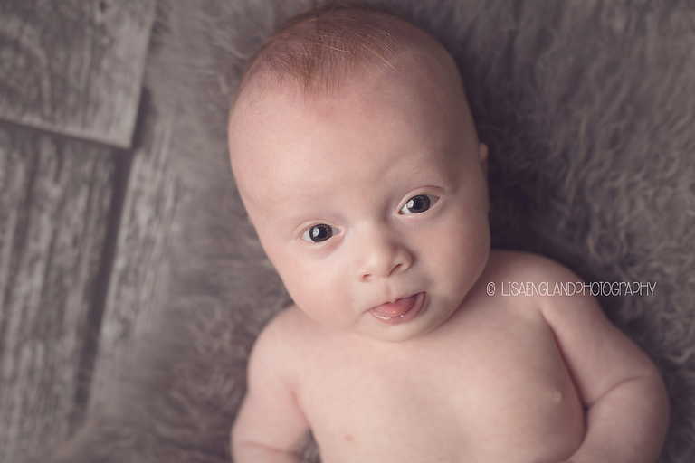Lisa England Photography | handsome baby boy sticking his tongue out