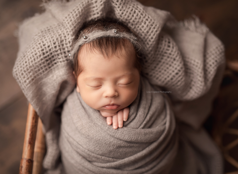 newborn wrapped posed