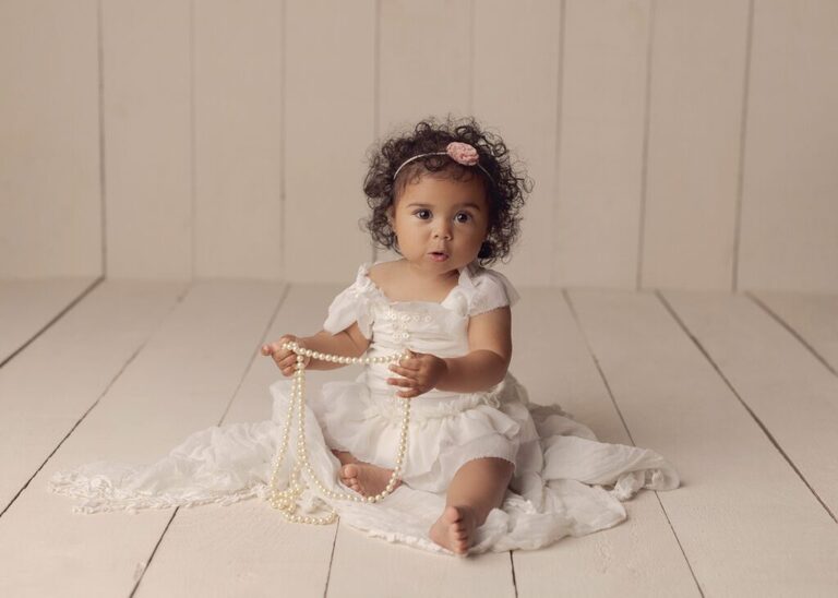 Baby milestone session. One year old girl all dressed up for her session.