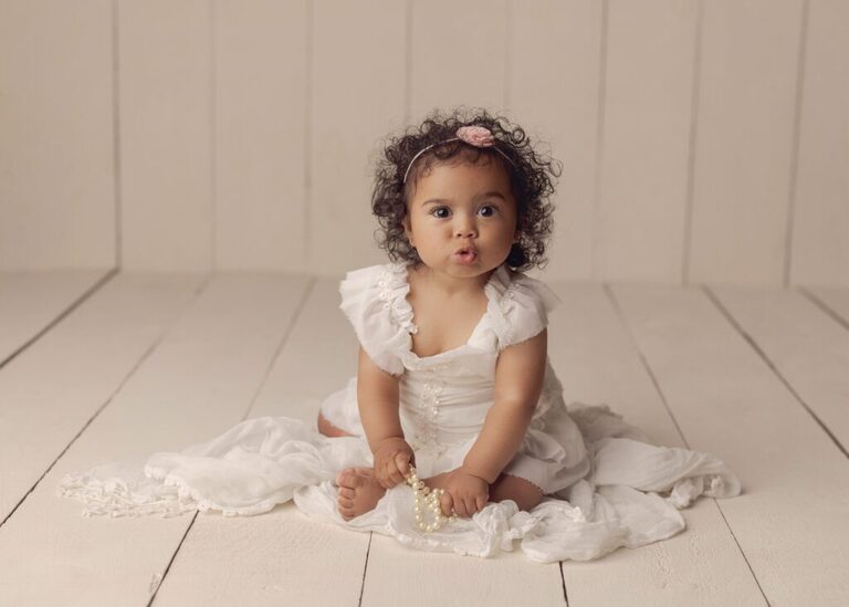 Baby milestone session. One year old girl all dressed up for her session.