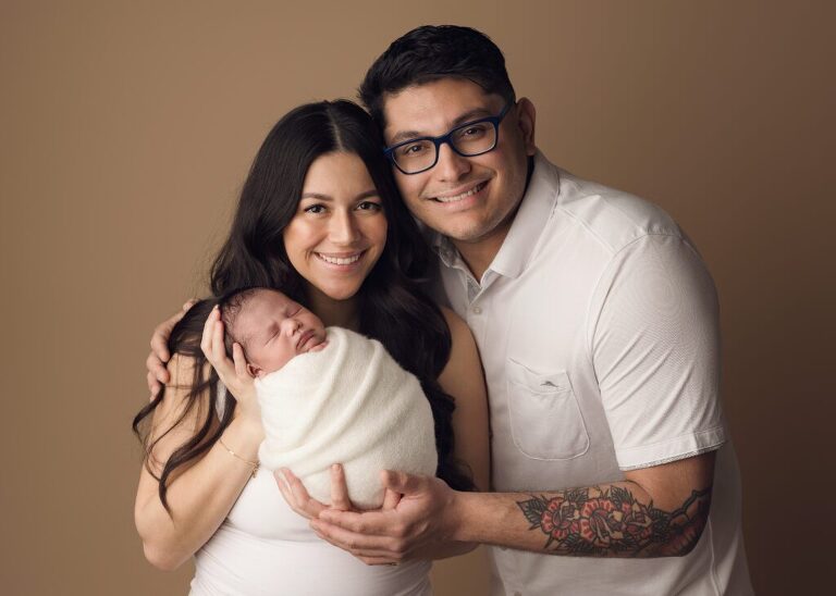 Beautiful parent pose for this new family of three during their newborn session in San Diego