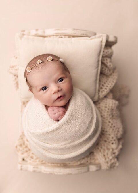 awake newborn wrapped during her San Diego newborn photo session