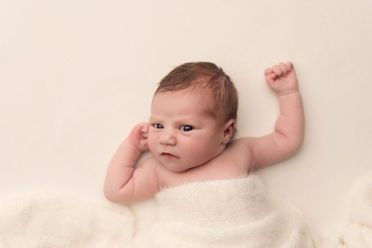 awake newborn girl with bright eyes during her San Diego newborn photography session