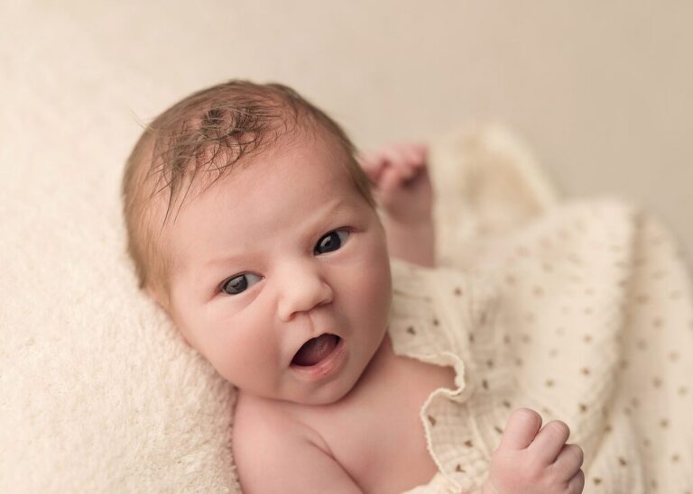 close-up of an awake newborn baby girl