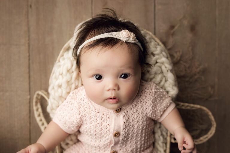 Three month old baby girl during milestone photography session in San Diego